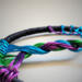 details of braided tree trunk shown from the side alonf with multicolor roots